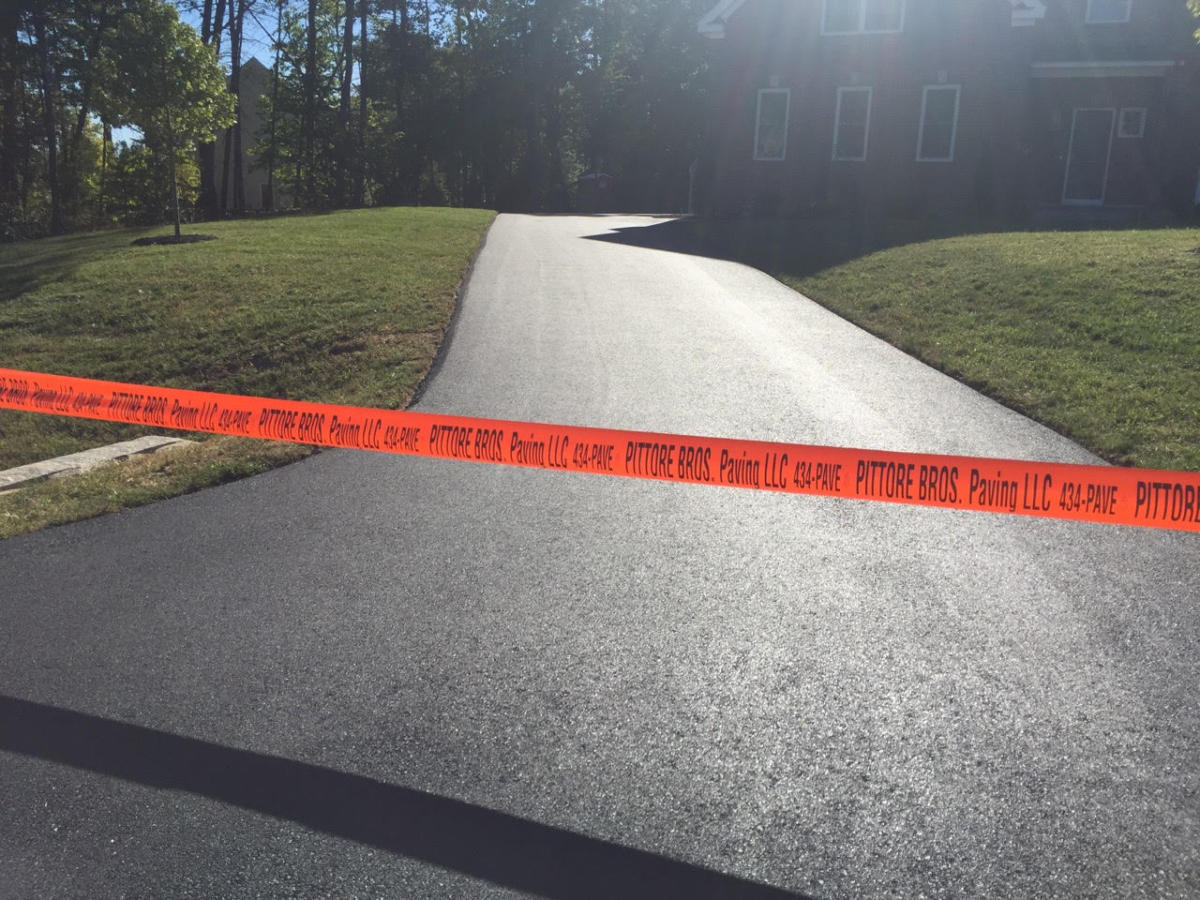 Freshly paved residential asphalt driveway in Southern New Hampshire
