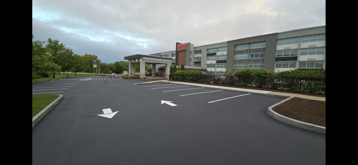 Commercial parking lot with fresh asphalt surface in NH