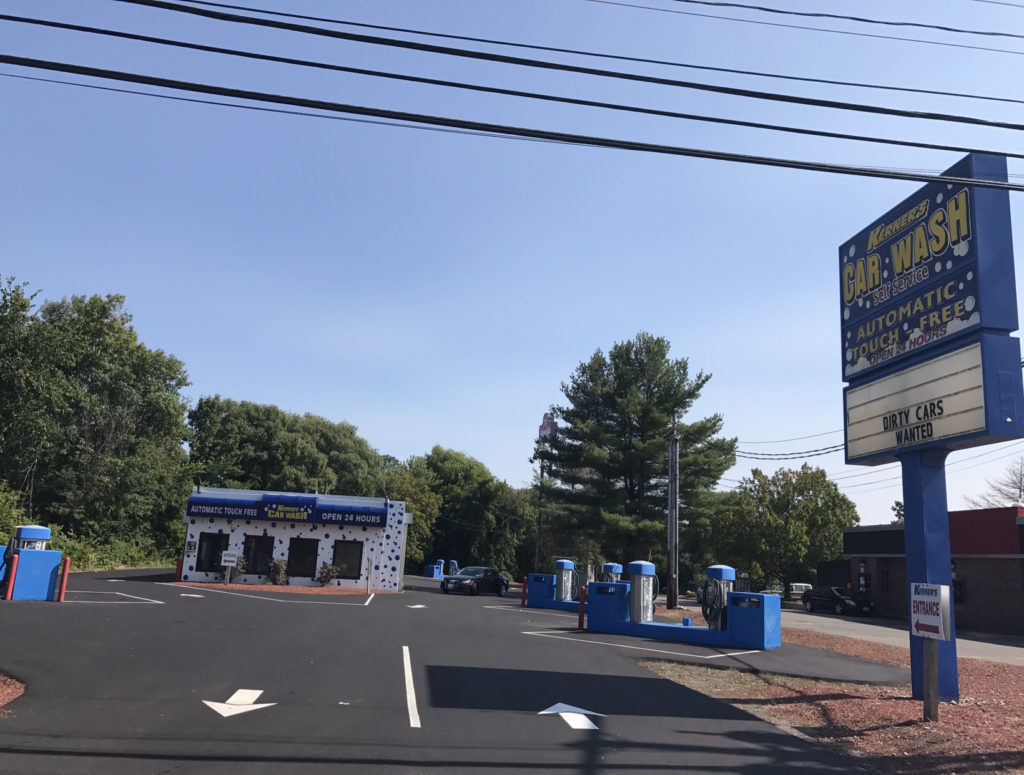 Crew paving a commercial parking lot in Southern NH